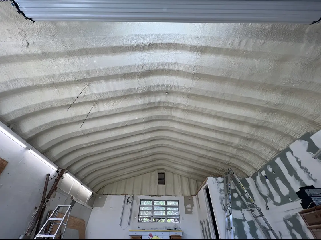 Spray polyurethane foam applied to the underside of a metal roof deck in Ettrick